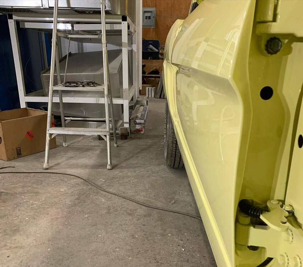 SPRINGTIME YELLOW PARTS OF THE CAR OF  1966 FORD MUSTANG